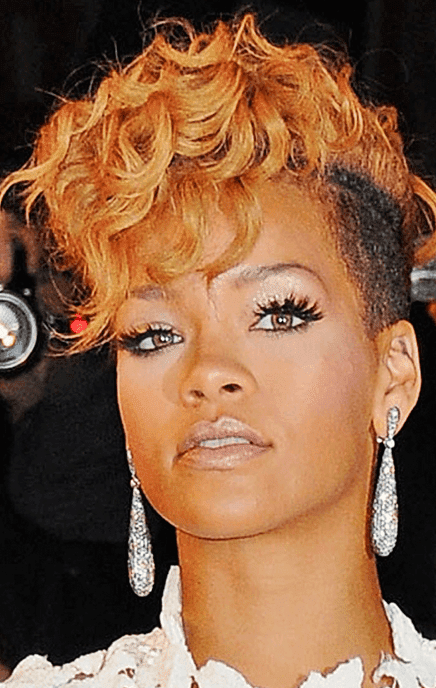 Photo_of_Rihanna_with_her_extreme_short_haircut_with_long_curly_top_and_bangs_in_orange_red_hair